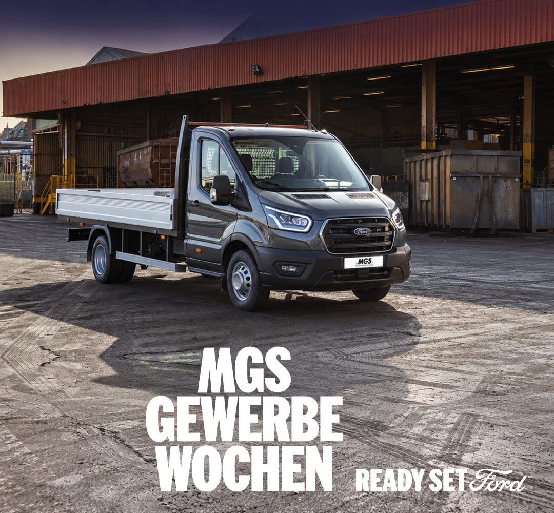 MGS Gewerbewochen mit einem grauen Ford Transit Pritschenwagen auf einem Gewerbegelände sowie dem Schriftzug „Ready Set Ford“.