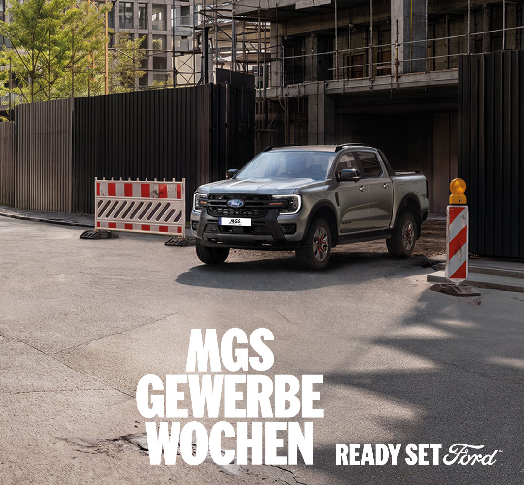 MGS Gewerbewochen mit einem grauen Ford Ranger vor einer Baustelle in städtischer Umgebung sowie dem Schriftzug „Ready Set Ford“.