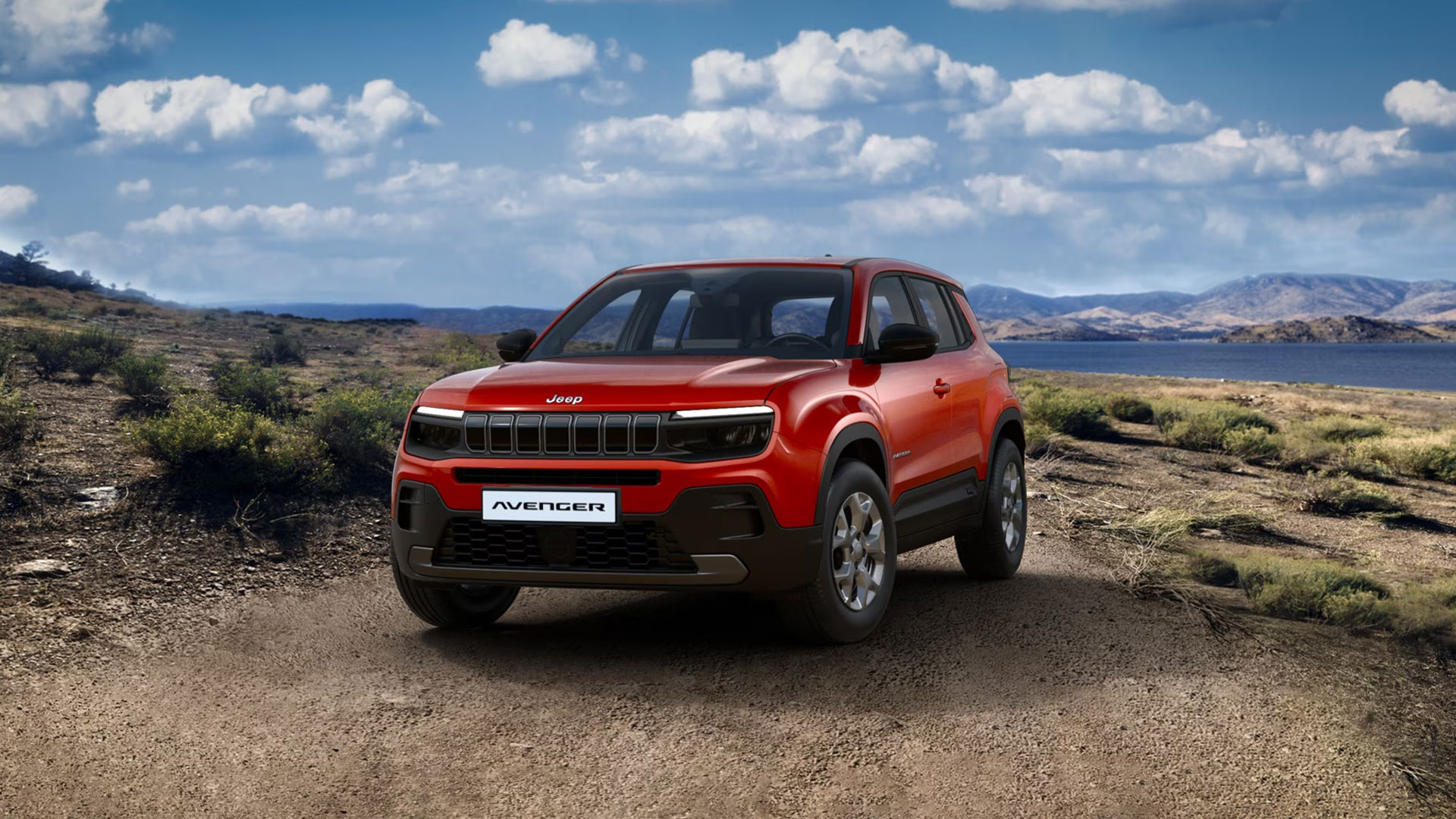 Jeep Avenger e-Hybrid Longitude in Ruby Red von vorne. Im Hintergrund eine Landschaft zu sehen