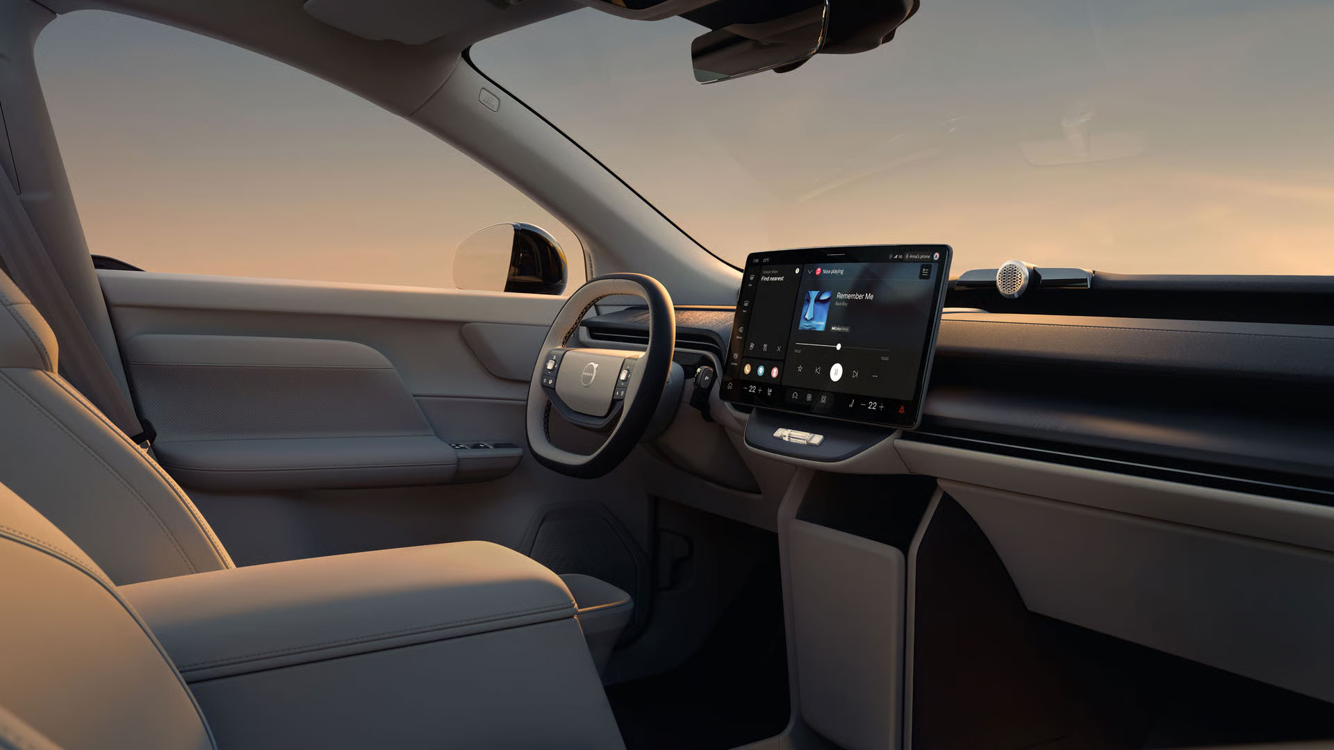 Der Innenraum des Volvo EX60 mit Lenkrad, Center Display und Vordersitzen